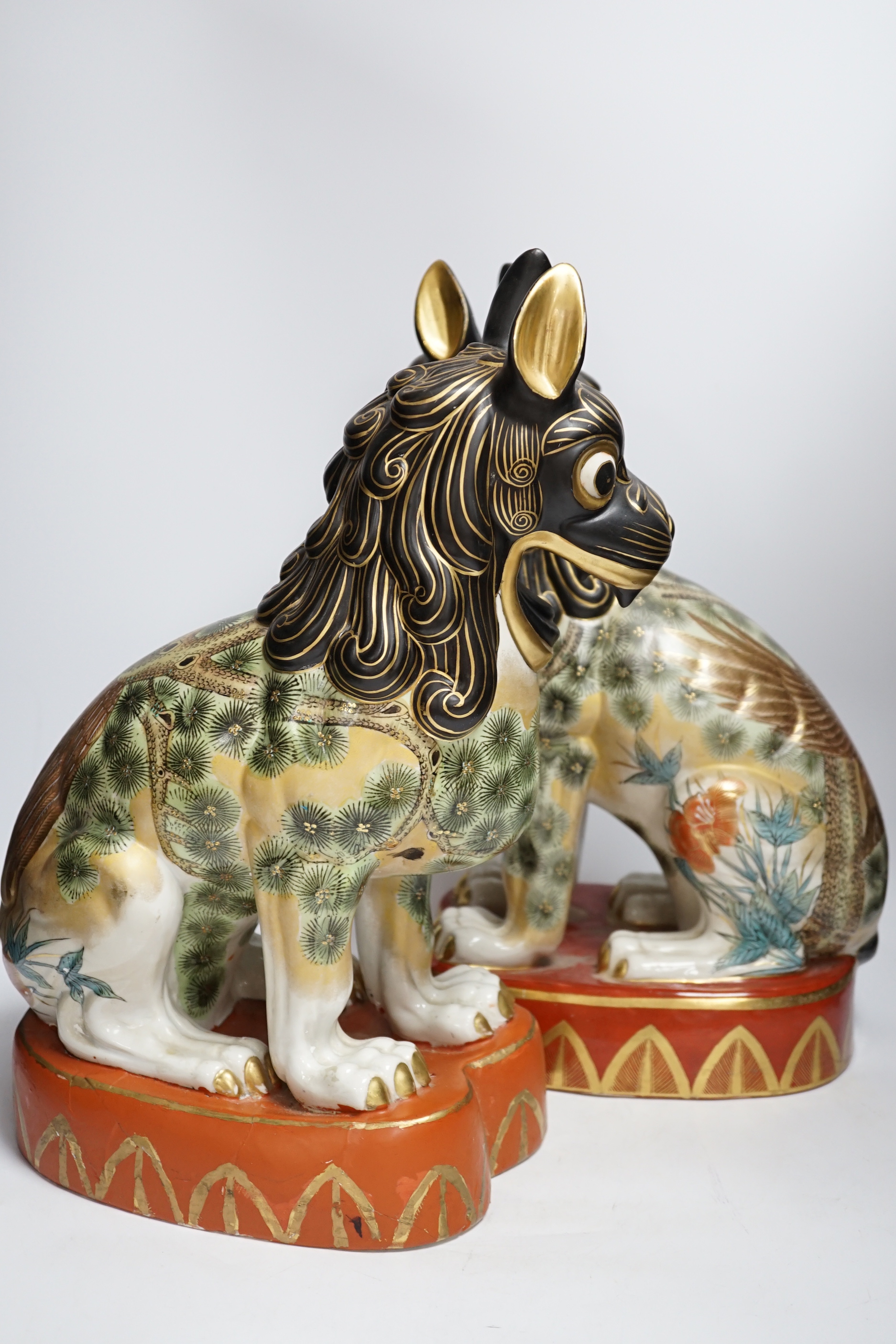 A pair of Chinese Macau porcelain lion dogs, 43cm